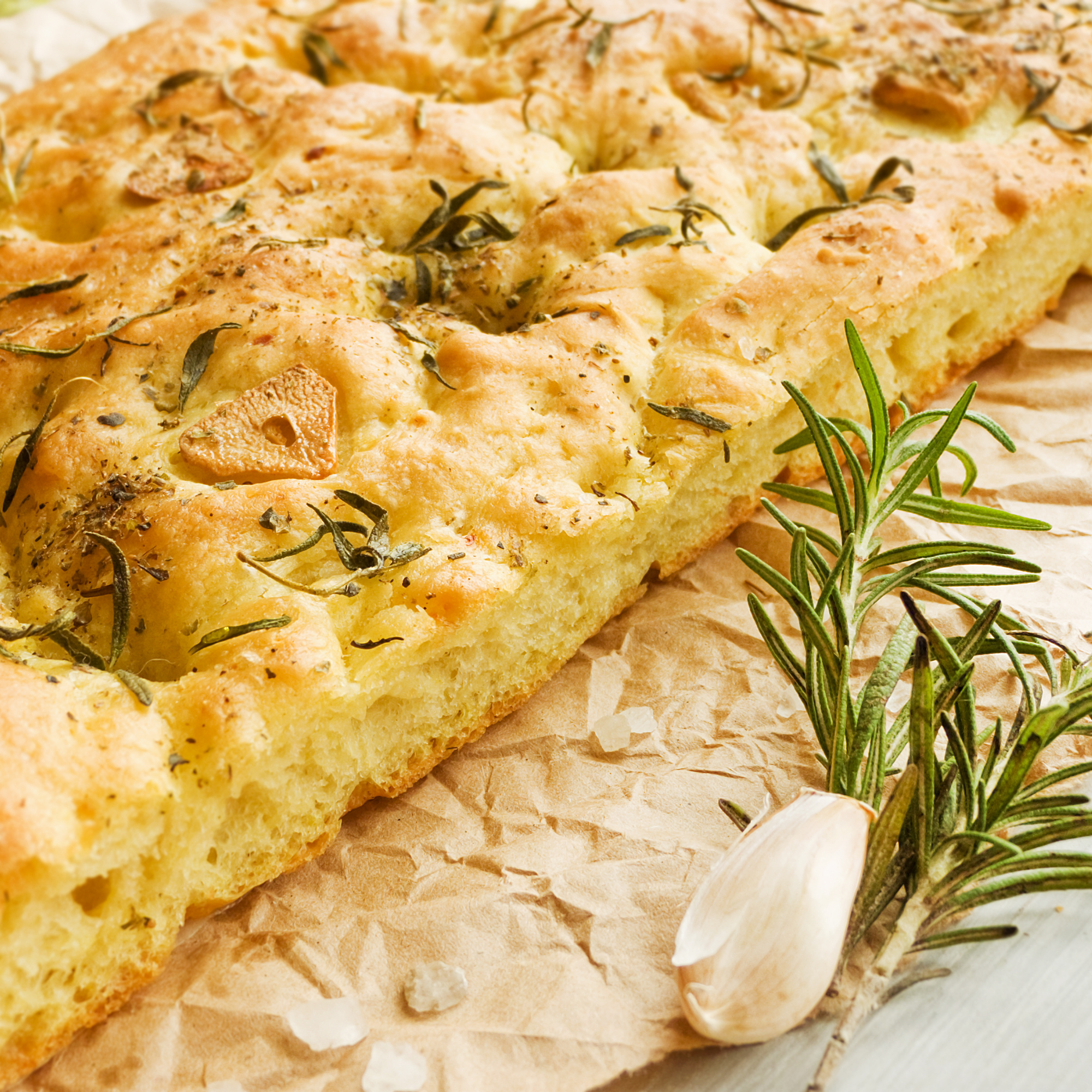 Photo of focaccia bread with shallots and rosemary.